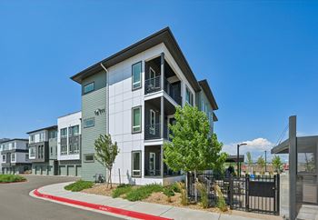 Modern three story apartment building exterior with balconies